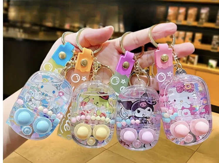 Брелок C 73127 (24) ЦІНА ЗА 12 ШТУК В УПАКОВЦІ водна гра, герой, кульки в середині, металеве кільце, карабін, гумовий ланцюжок, в пакеті